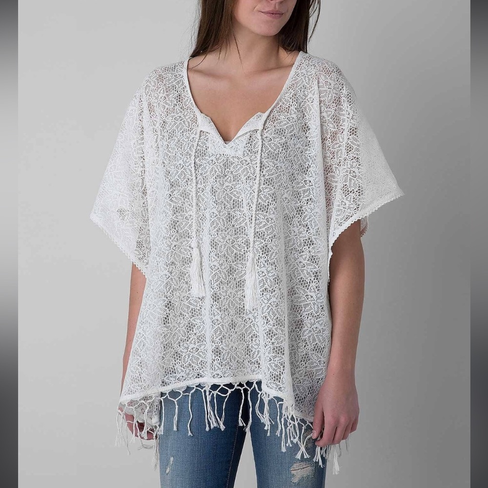 Billabong light shines through poncho size small